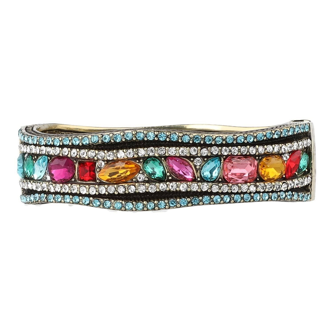 Multicolored gemstone bracelet with clear stones on a white background