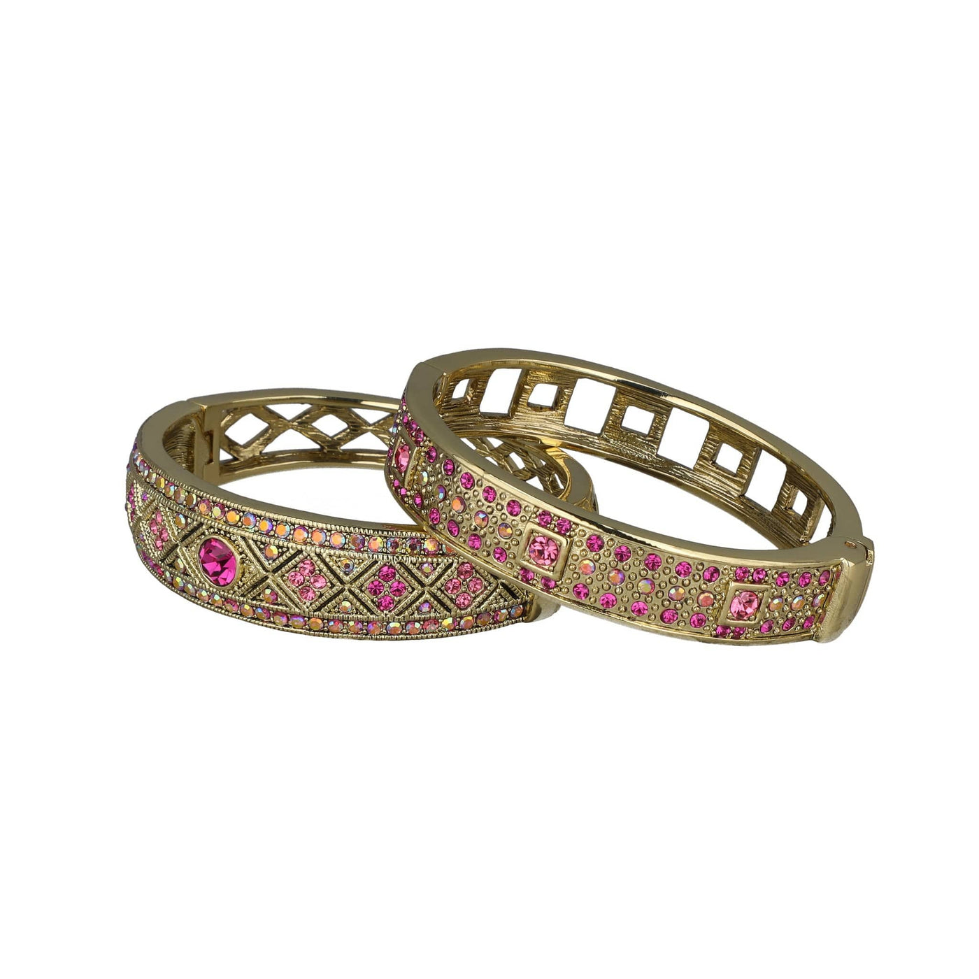 Two gold bangles with pink gemstones on a white background. daily double bracelet set by heidi daus