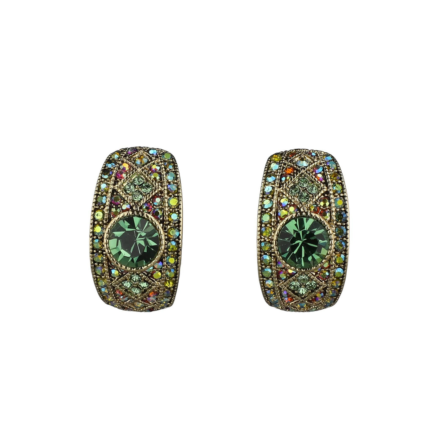 Pair of ornate earrings with green gemstones on a white background