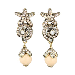 Starfish-shaped earrings with pearl-like beads on a white background