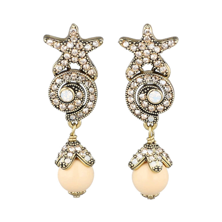 Starfish-shaped earrings with pearl-like beads on a white background