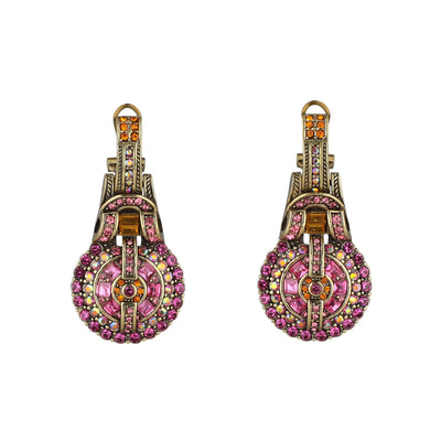 Pair of ornate earrings with pink and multicolor gemstones on a white background