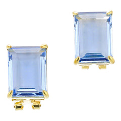 Pair of blue gemstone earrings with gold settings on a white background