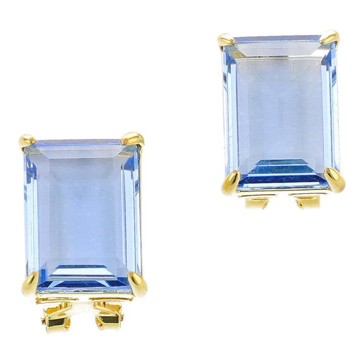 Pair of blue gemstone earrings with gold settings on a white background