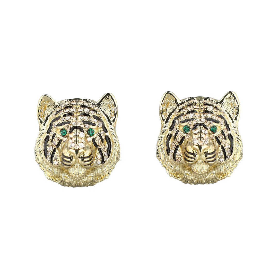 Gold tiger head earrings with green gemstones on a white background
