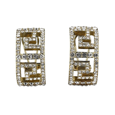Pair of gold and crystal earrings on a white background
