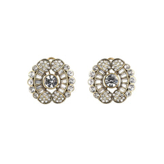 Pair of ornate earrings with crystal details on a white background