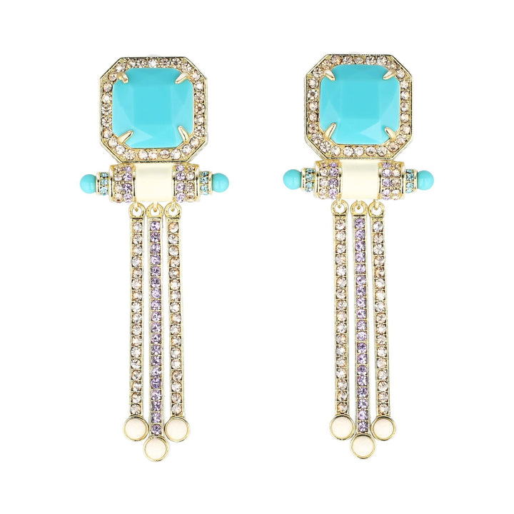 Pair of earrings with turquoise stones and gold accents on a white background