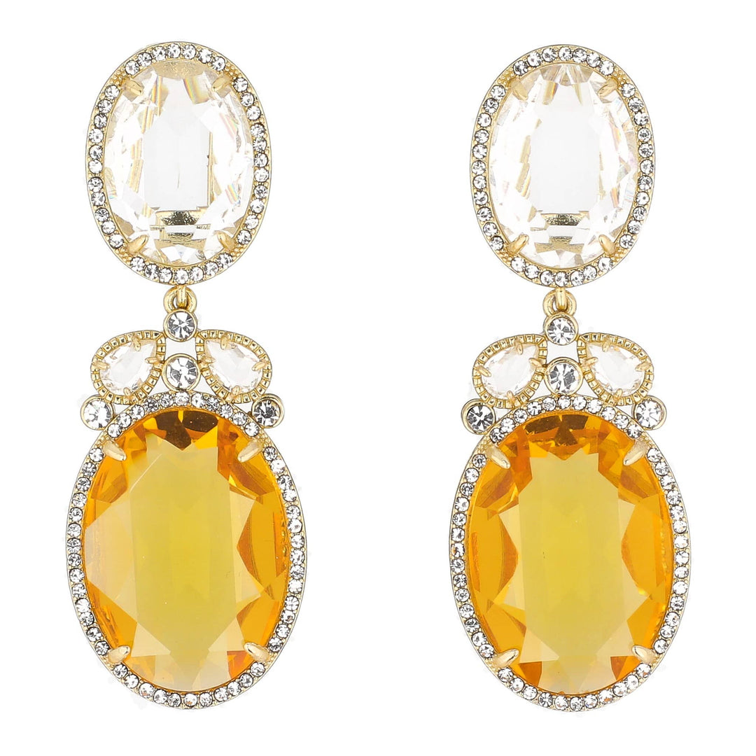 Pair of earrings with yellow gemstones and gold accents on a white background