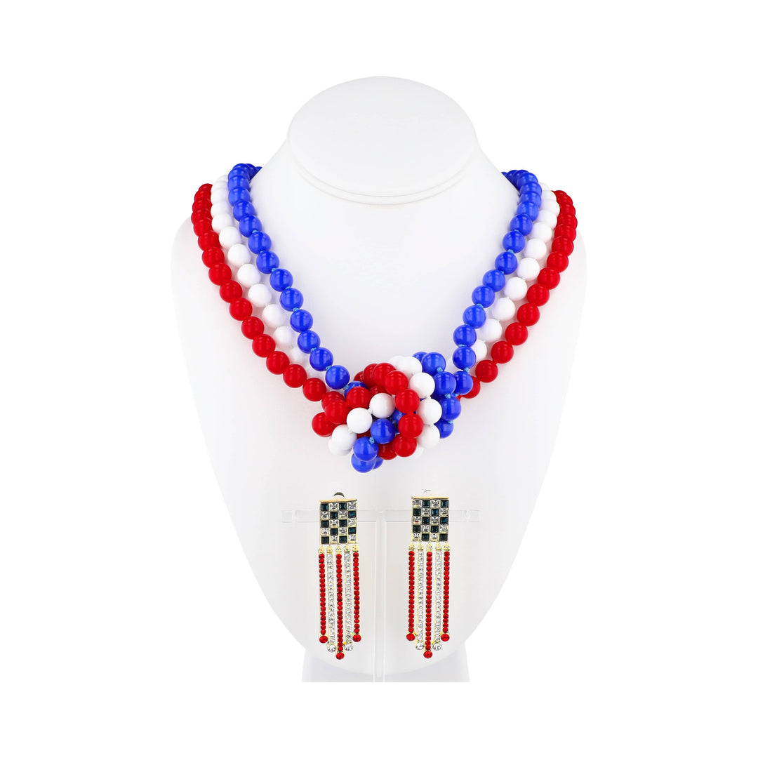 Red, white, and blue beaded necklace and earrings on a mannequin bust.