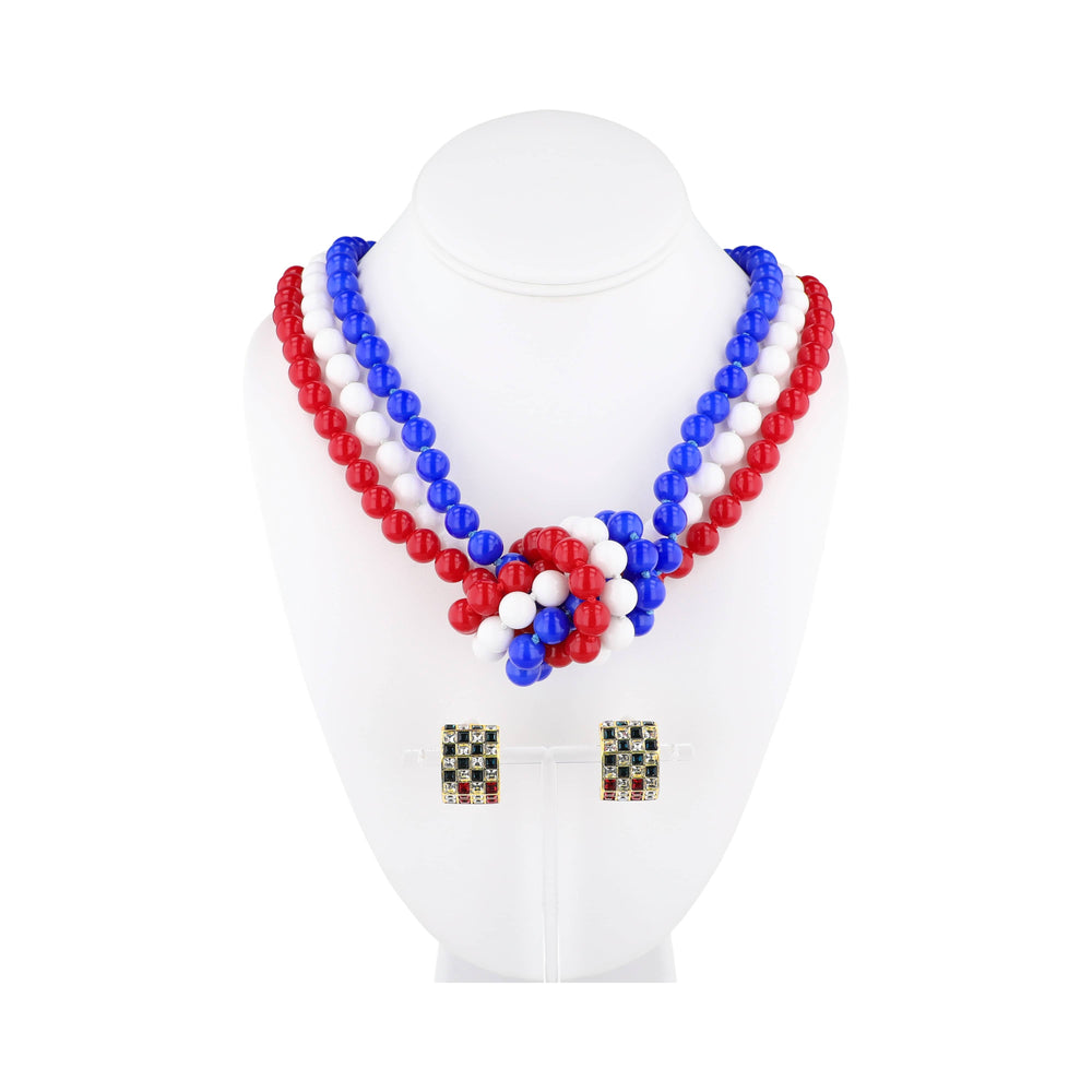 Beaded necklace with red, white, and blue beads on a mannequin bust.