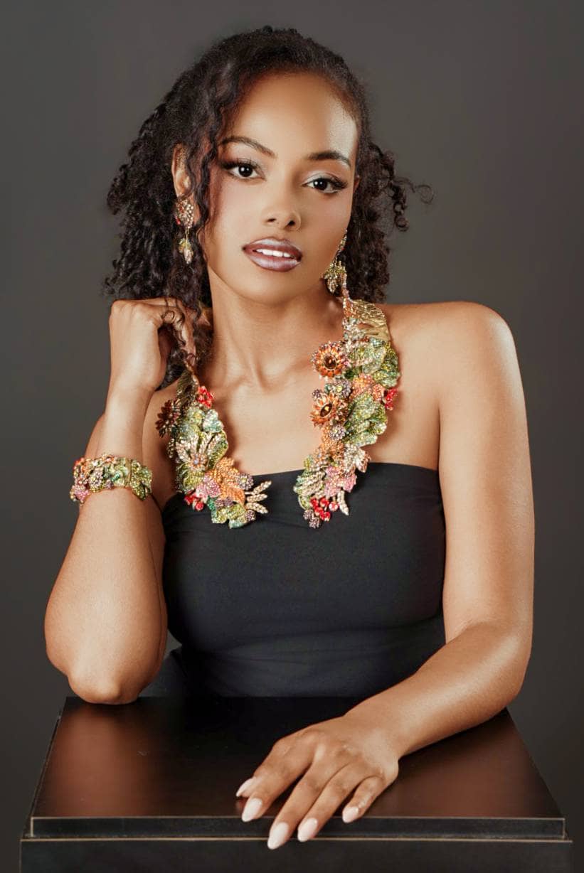 Goddess of Abundance necklace, earrings and bracelet styled together on a model