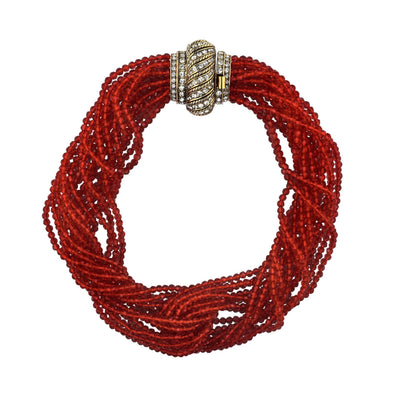 Red beaded bracelet with a decorative clasp on a white background