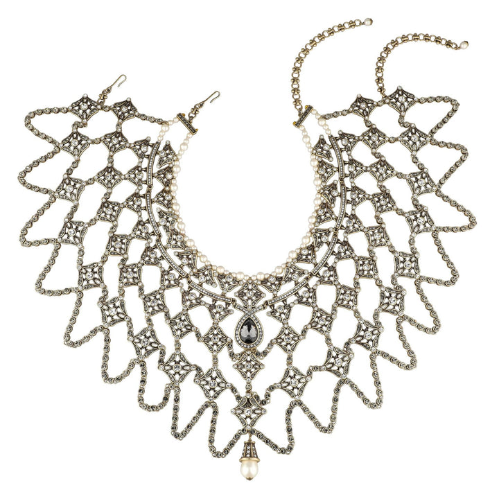 Decorative necklace with intricate design on a white background