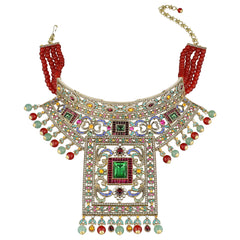 An ornate gold-toned statement necklace with red beaded shoulder straps, a wide curved collar, and a large central rectangular pendant. The necklace is heavily embellished with multicolored rhinestones and gemstone-like accents in green, pink, yellow, and blue, with dangling bead strands and a chain clasp, shown on a plain white background.
