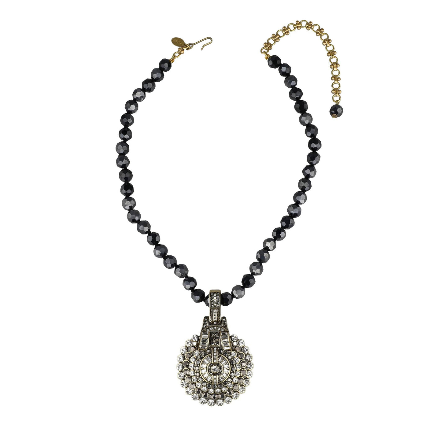 Necklace with black beads and a decorative clasp on a white background