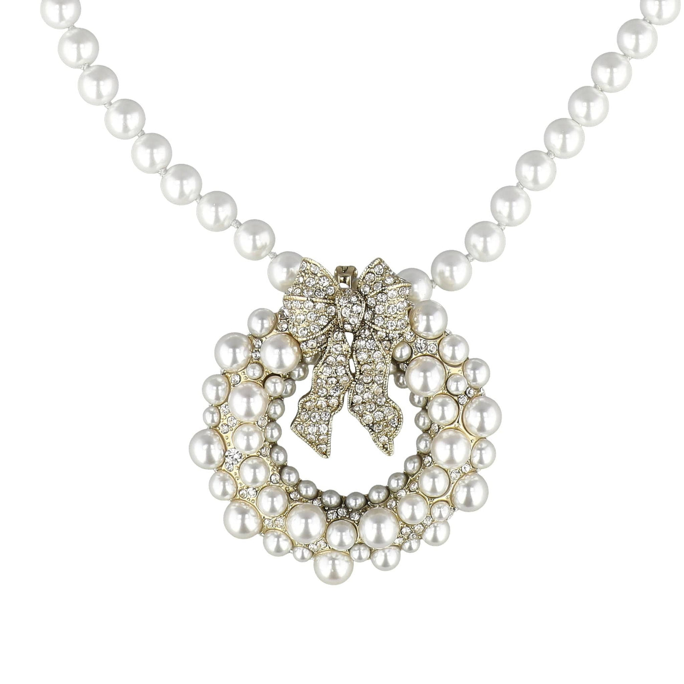 Pearl necklace with a decorative bow clasp on a white background