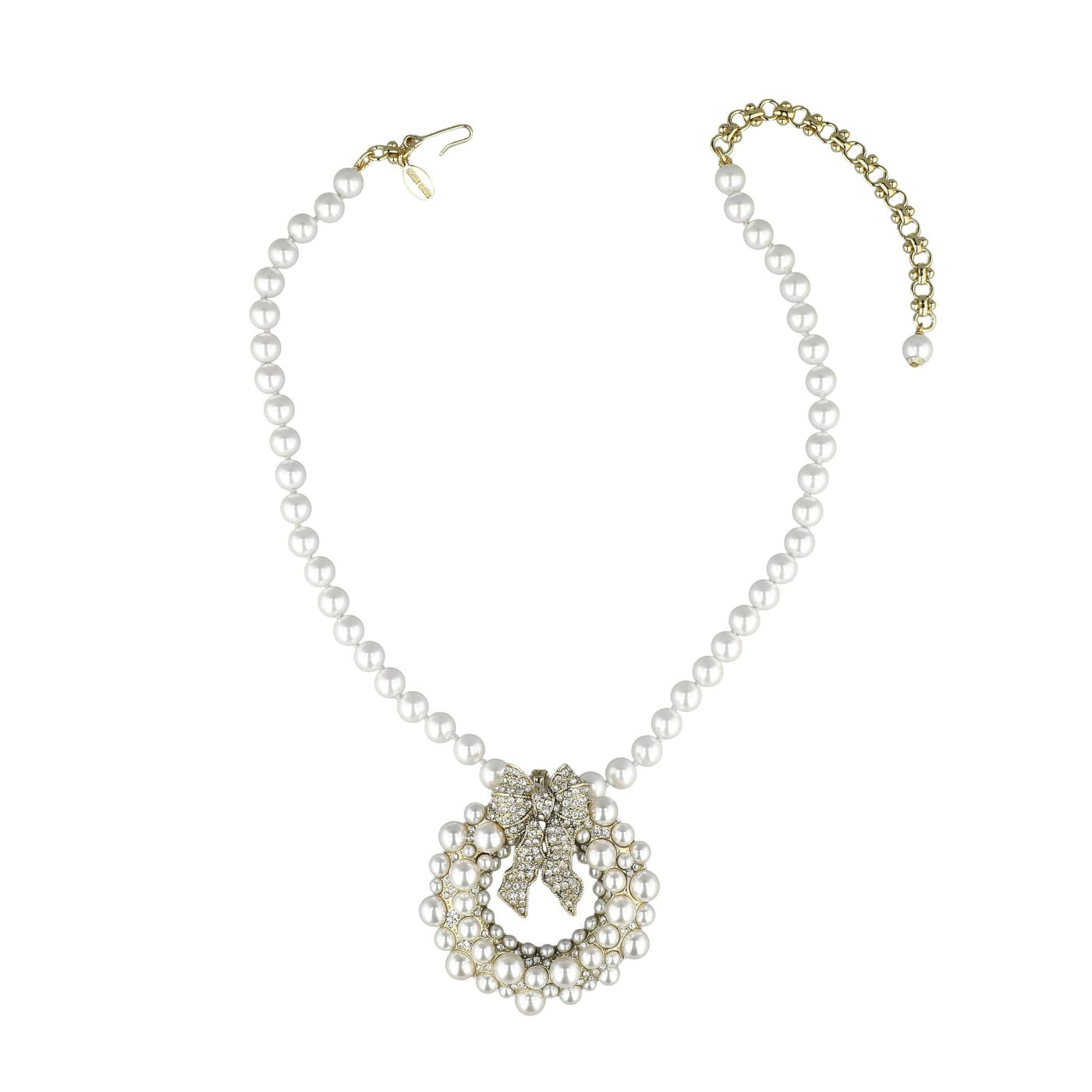 Pearl necklace with a decorative clasp on a white background