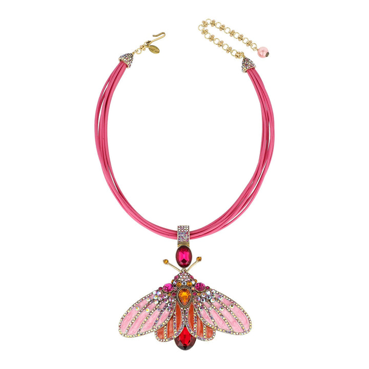 Pink necklace with a detailed pendant on a white background