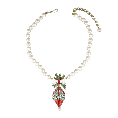 Pearl necklace with a decorative pendant on a white background
