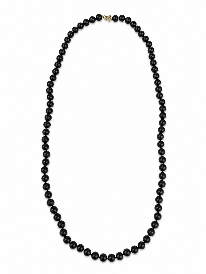A classic black beaded necklace with a small gold clasp, displayed against a solid white background.