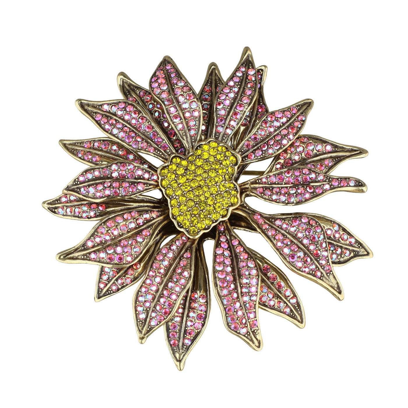 Decorative brooch with pink gemstones and a yellow center on a white background