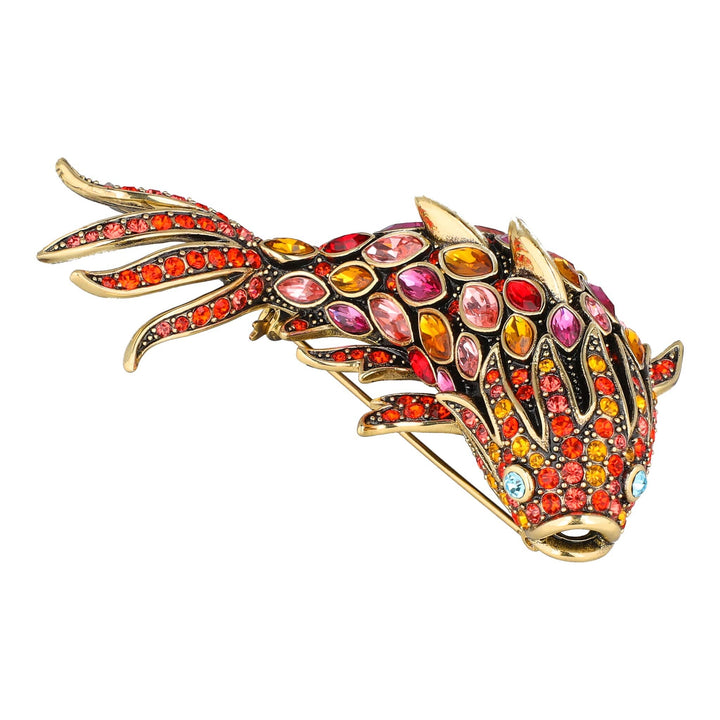 Multicolored jeweled brooch on a white background