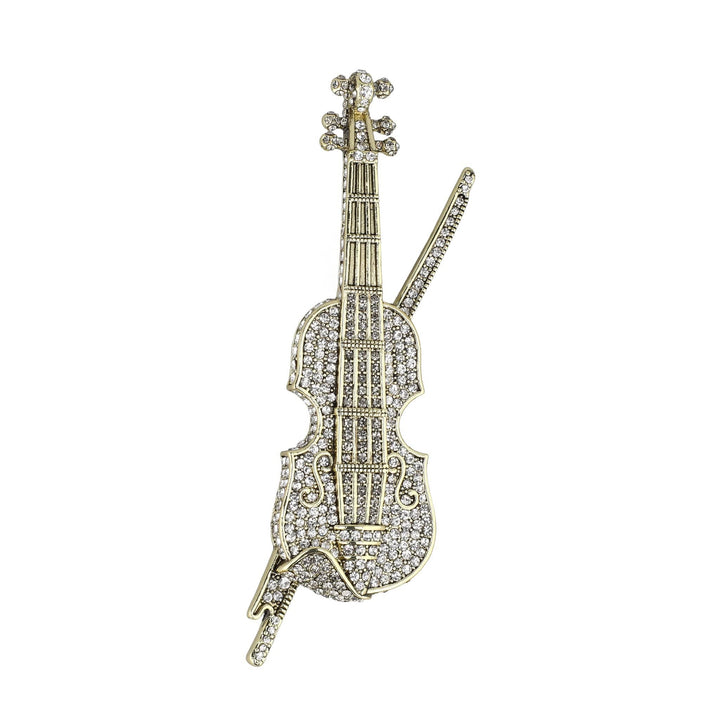 Decorative violin-shaped object with rhinestone embellishments on a white background