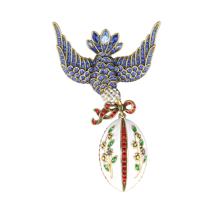 Decorative brooch with an eagle design on a white background