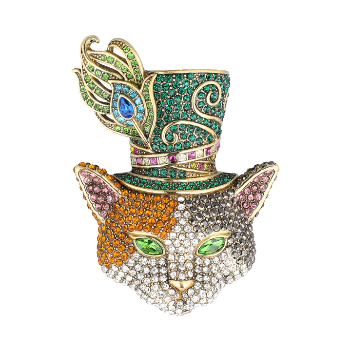 A highly detailed, multicolored jewelry piece shaped like a cat's head wearing a top hat. The cat's face is paved with clear and colored rhinestones in orange, green, pink, and silver/white tones, with green gemstone eyes.