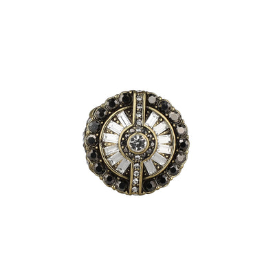 Decorative button with black and gold accents on a white background
