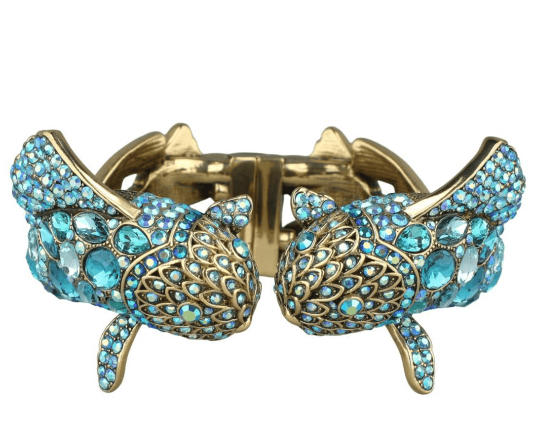 Gold and blue bracelet with intricate design on a white background