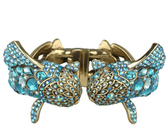 Gold and blue bracelet with intricate design on a white background