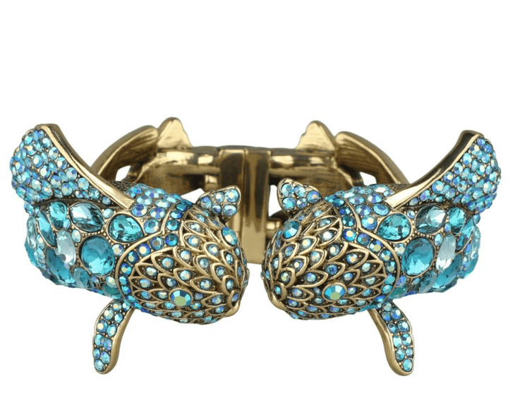 Gold and blue bracelet with intricate design on a white background