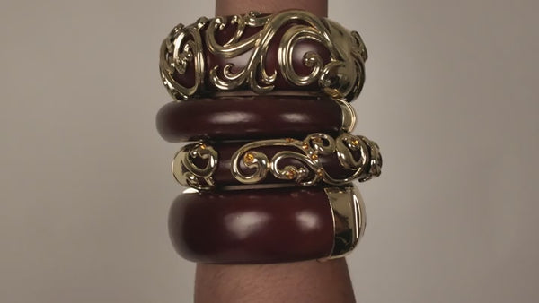 Rooted Elegance Mahogany wood bangles shown stacked: Heritage Scrollwork Wide and Slim, Essential Wide and Slim. Each bangle sold separately.