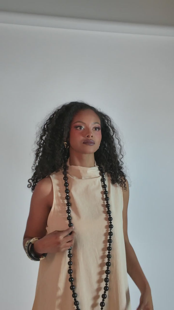 HEIDI DAUS® “Rooted Elegance” 60-Inch Graduated Wood Necklace — Ebony shown on a model; other jewelry shown for styling.
